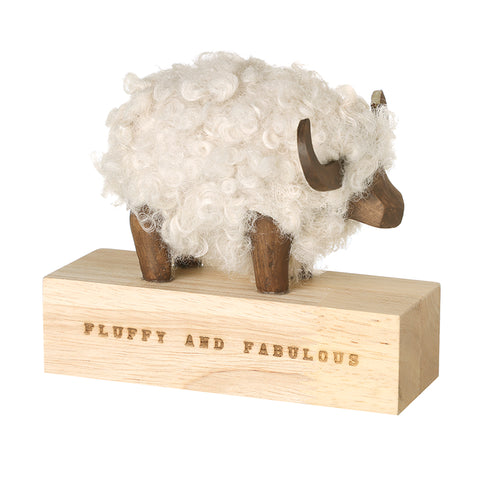 Festive Ram on a wood block