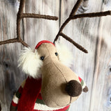 Sitting Reindeer in a stripy jumper