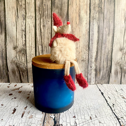 Sitting Mouse in red hat and scarf