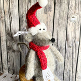 Sitting Mouse with a red hat and scarf