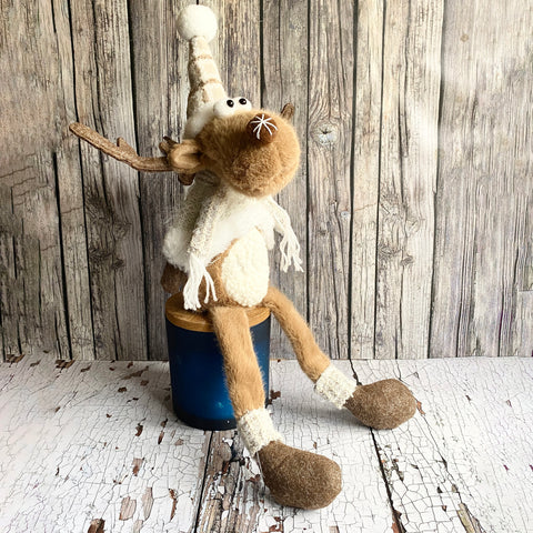 Shelf sitting Christmas Reindeer wearing a bob hat and scarf